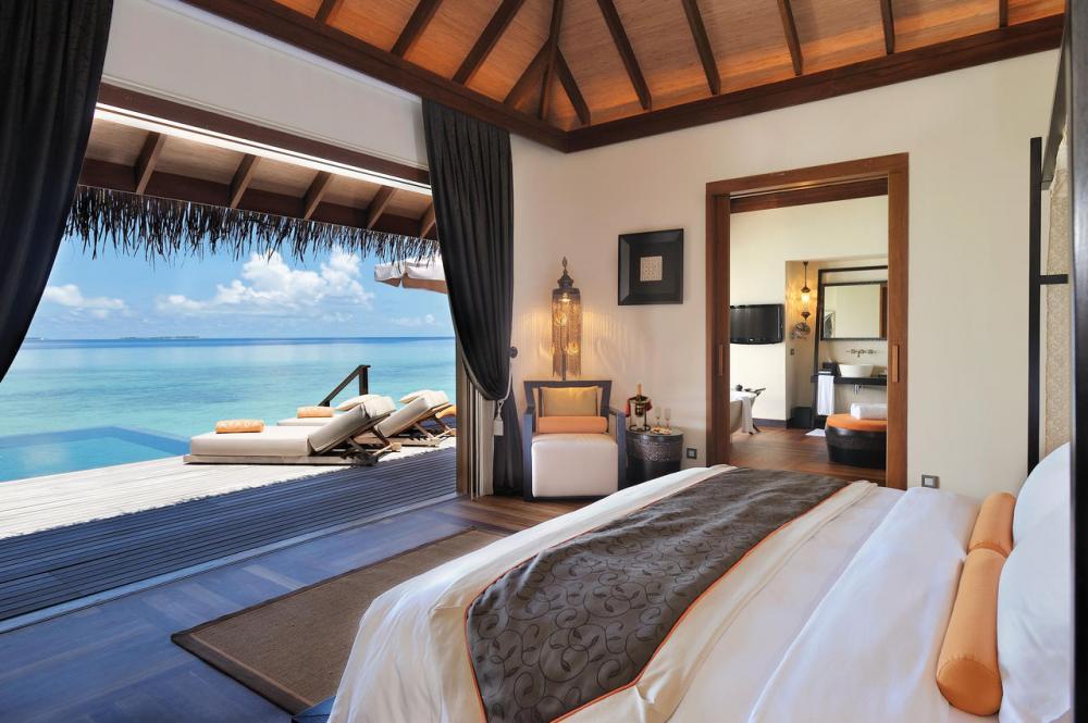 Luxury beachfront hotel with private pool in Maldives or Caribbean